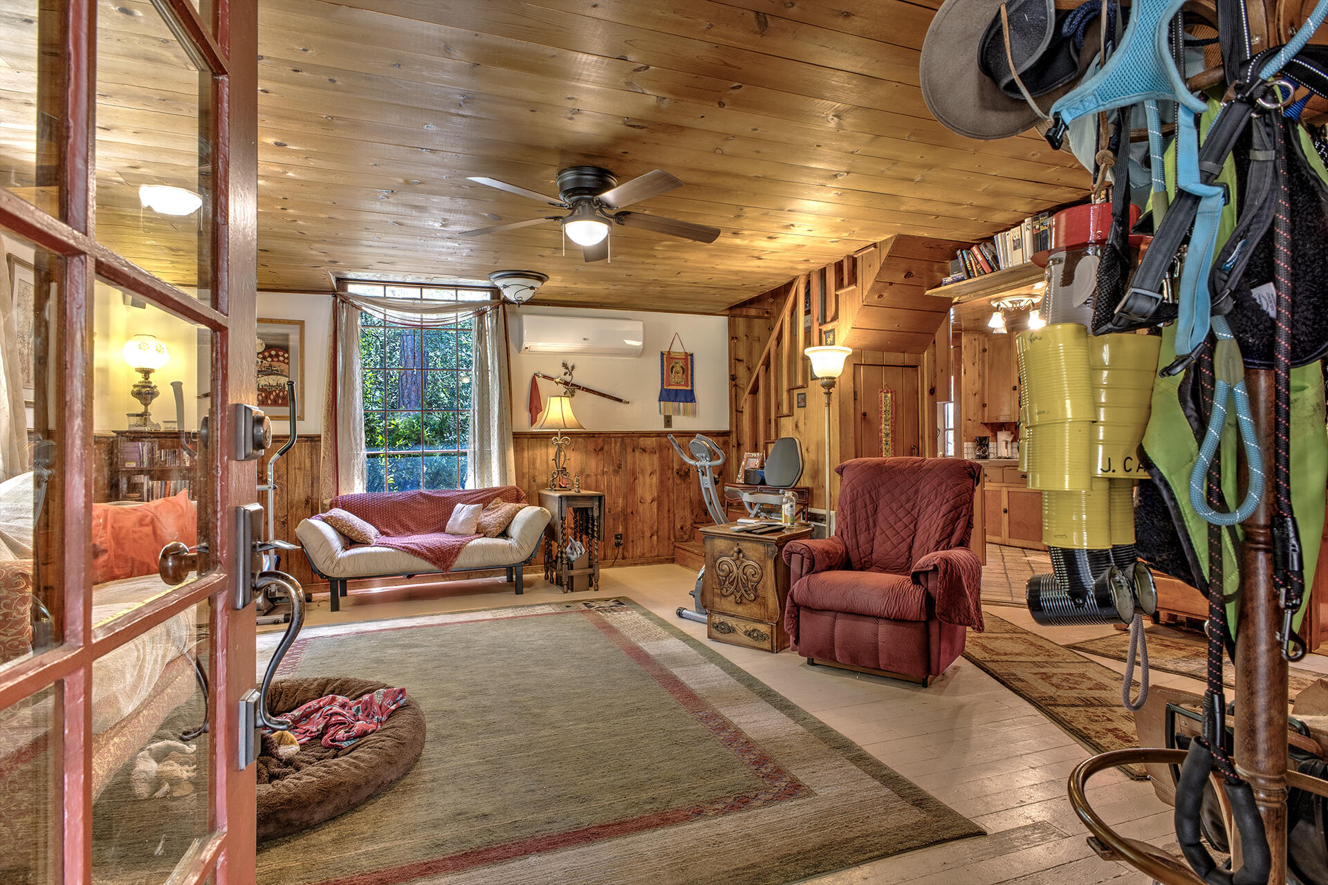 25395 Lodge Road Idyllwild, CA 92549 - Photo 4 of 53 a living room with furniture or couch and a floor to ceiling window