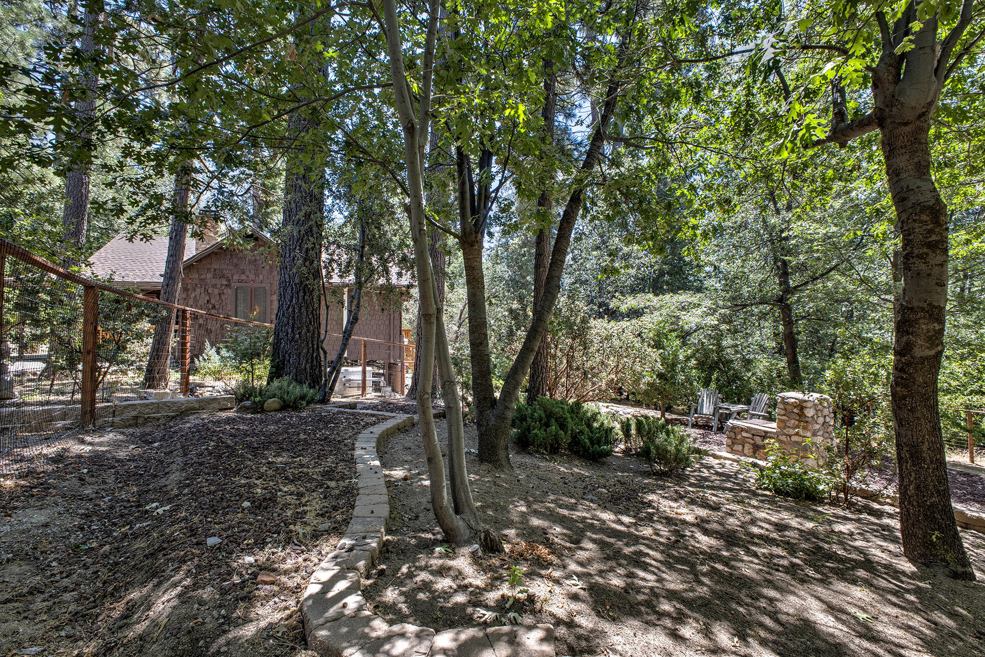 25395 Lodge Road Idyllwild, CA 92549 - Photo 43 of 53 a backyard of a house with lots of green space