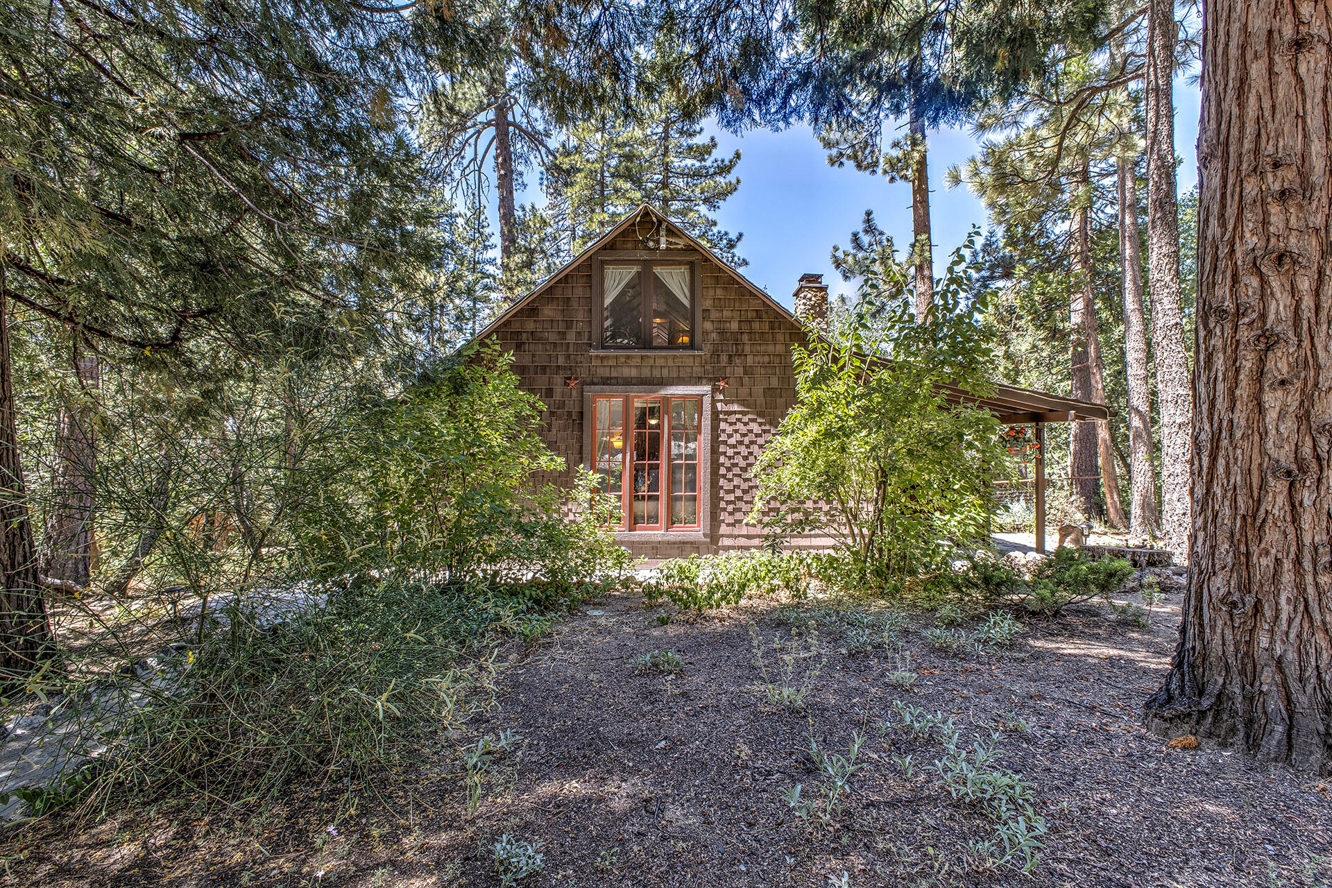 25395 Lodge Road Idyllwild, CA 92549 - Photo 51 of 53 a front view of a house with a yard and fountain
