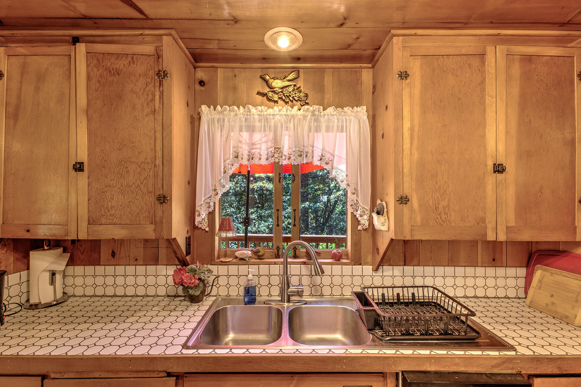 25395 Lodge Road Idyllwild, CA 92549 - Photo 9 of 53 a bathroom with a granite countertop sink and a mirror