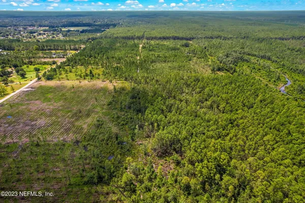a view of a lake with a yard