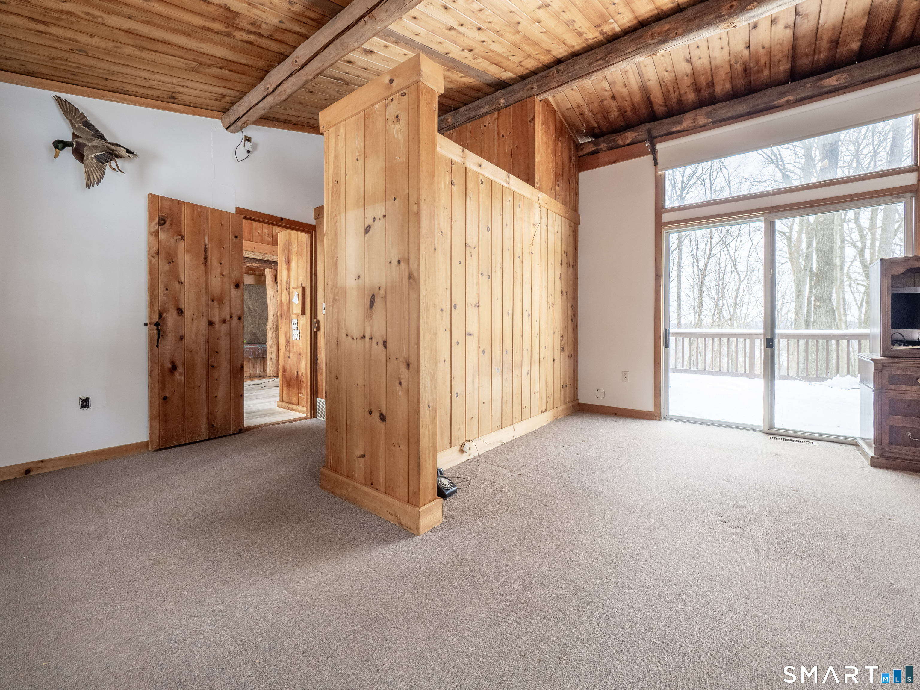 424 Old Sib Road Ridgefield, CT 06877 - Photo 16 of 27 Sliders to deck overlooking private property