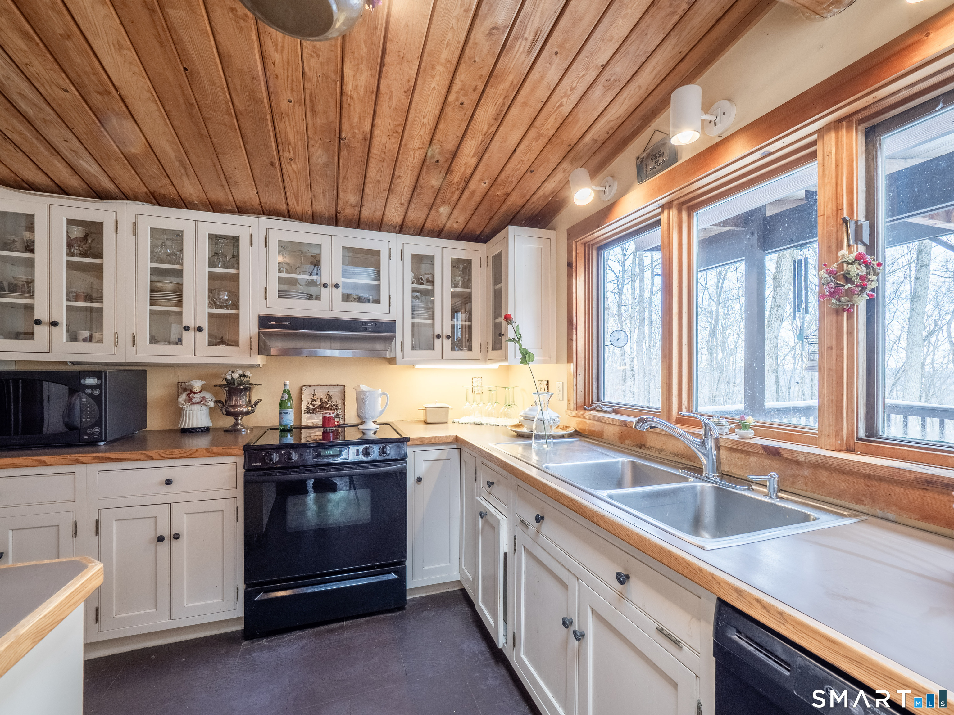 424 Old Sib Road Ridgefield, CT 06877 - Photo 16 of 27 a kitchen with stainless steel appliances granite countertop a sink a stove and cabinets
