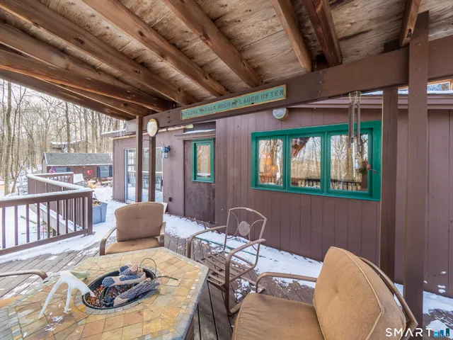 a view of a porch with furniture