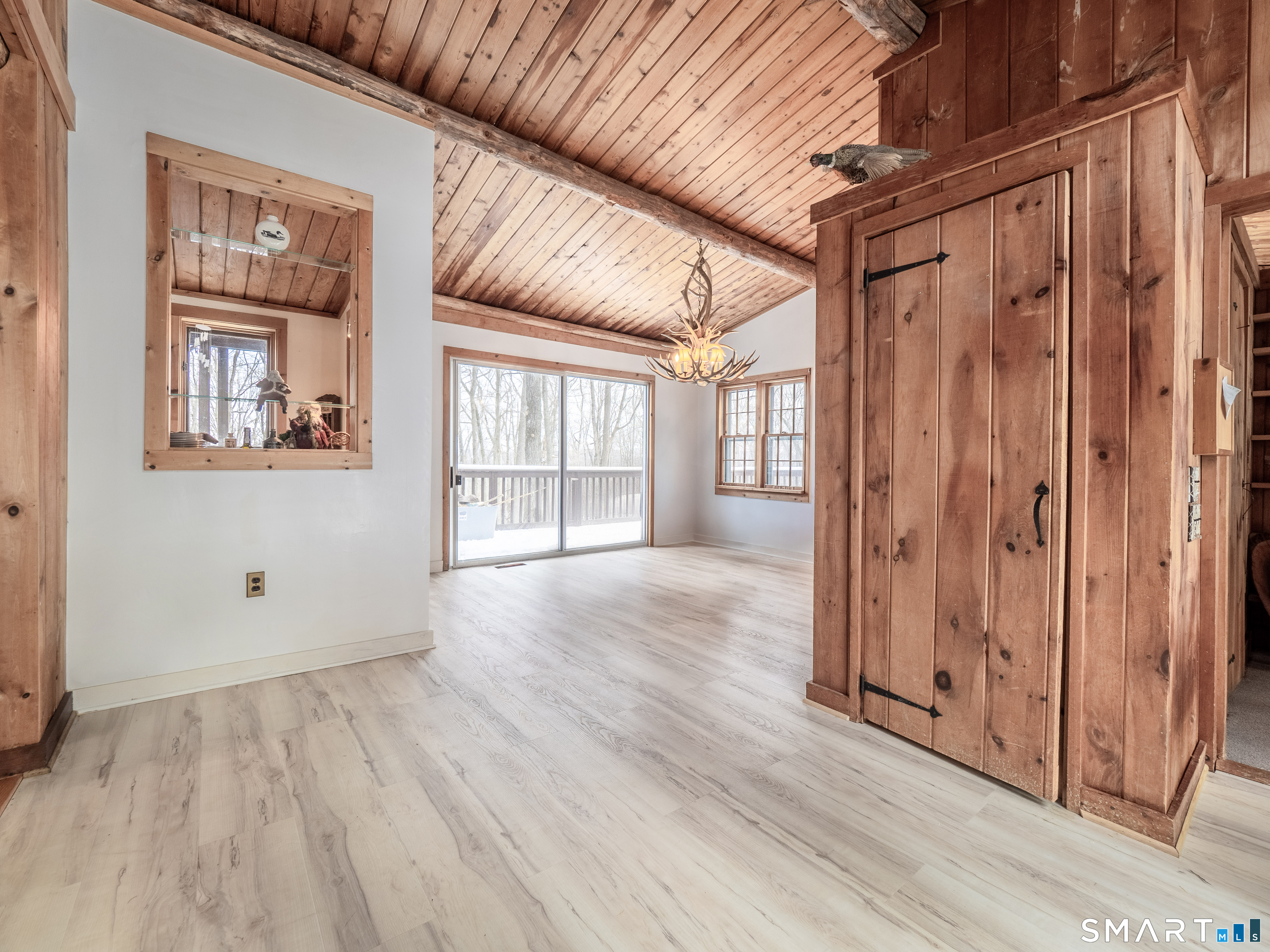 424 Old Sib Road Ridgefield, CT 06877 - Photo 3 of 27 a view of an empty room with wooden floor and a window