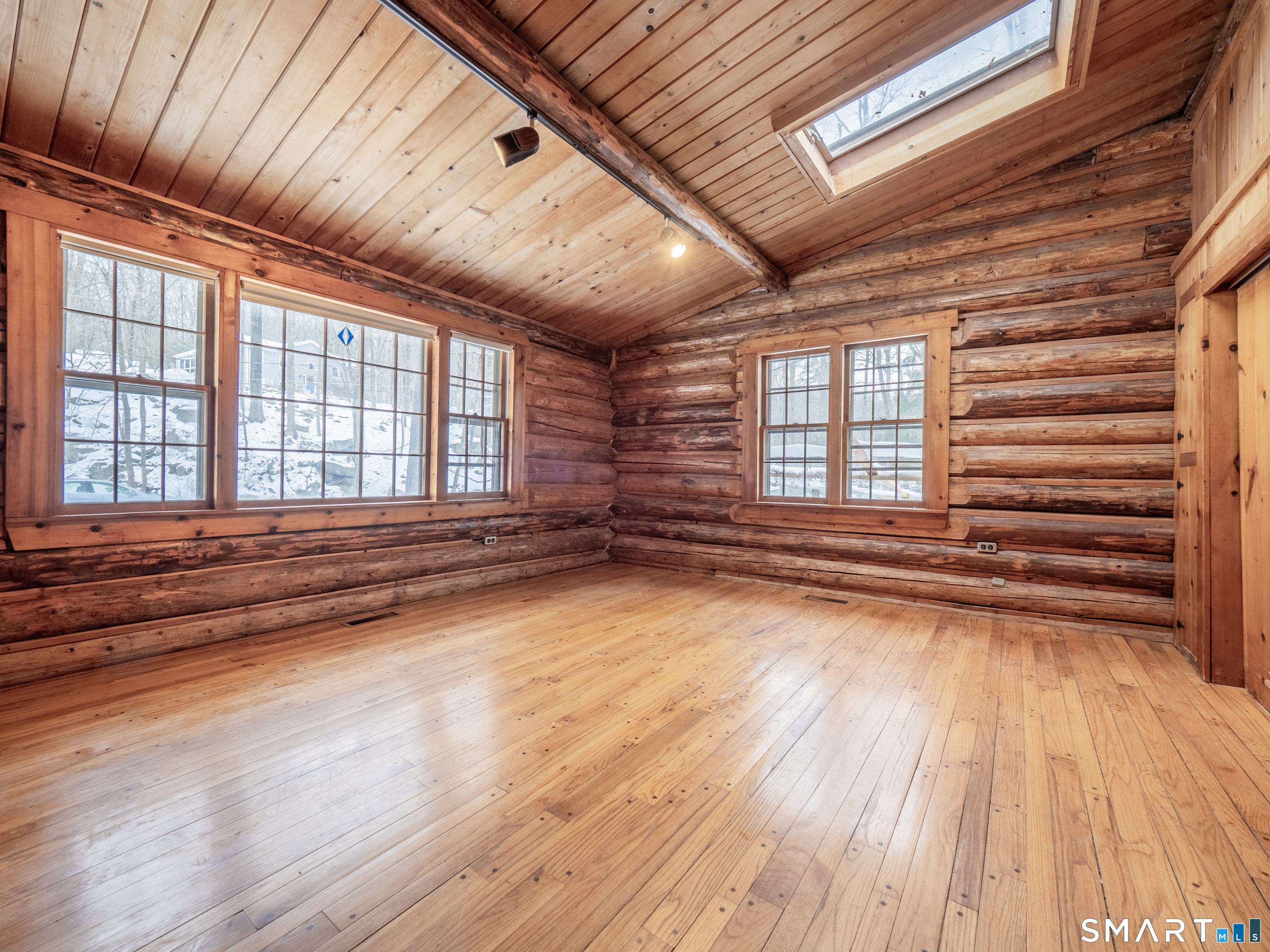 424 Old Sib Road Ridgefield, CT 06877 - Photo 10 of 27 a view of empty room with wooden floor and fan