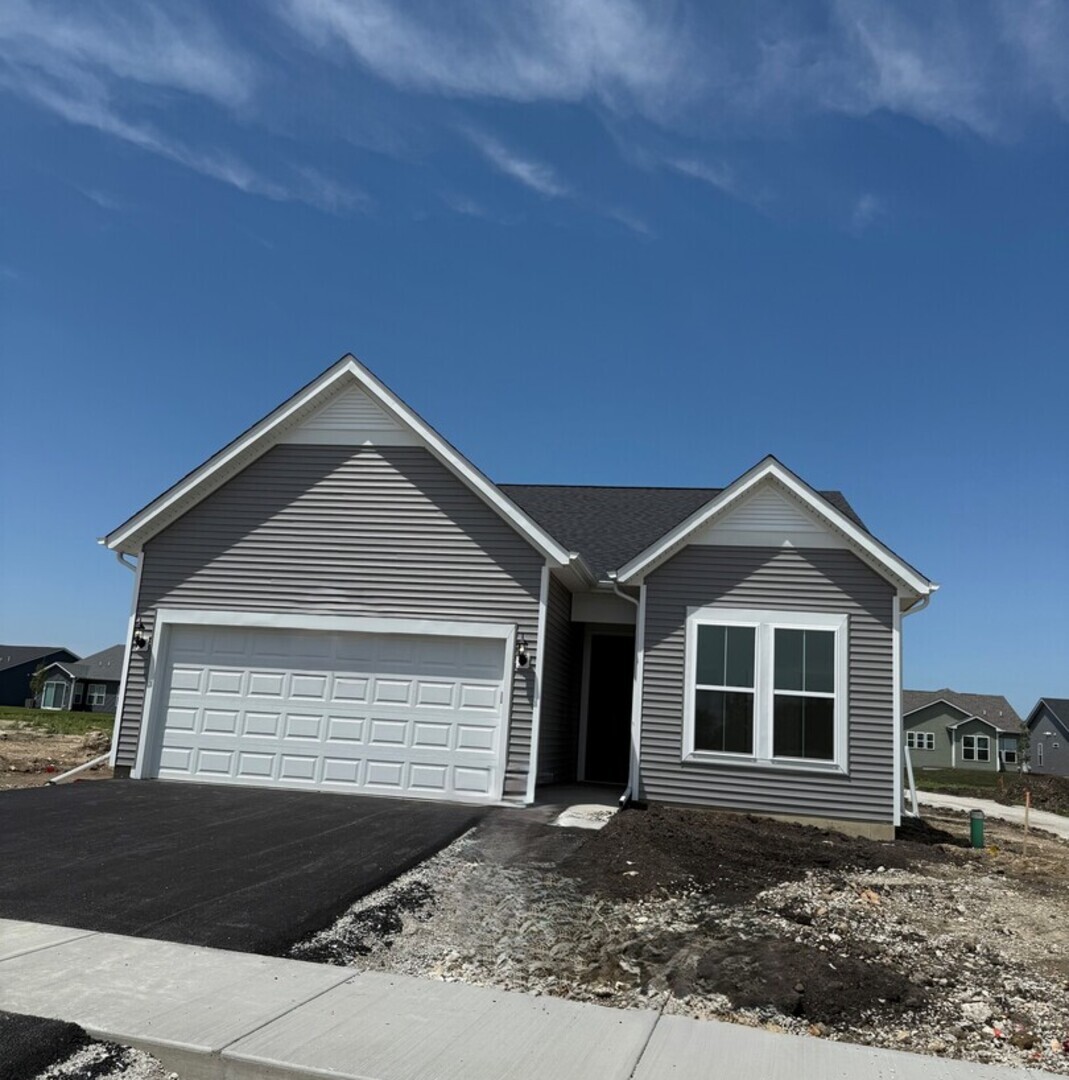 a front view of a house with yard