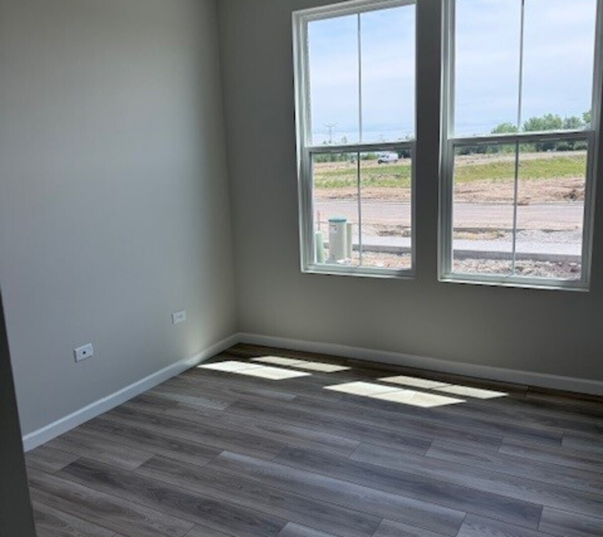 3302 Wildlight Road Aurora, IL 60503 - Photo 7 of 11 a view of an empty room with wooden floor and a window