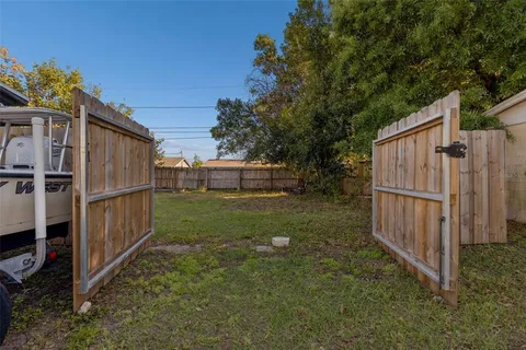 a view of backyard with tub and trees