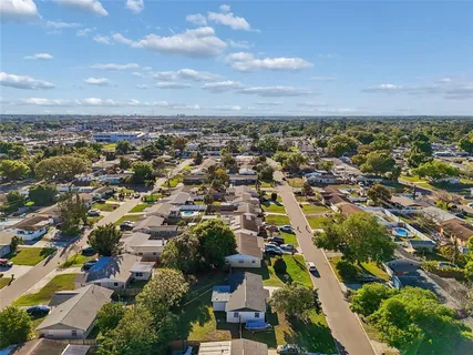 an aerial view of residential building with green space
