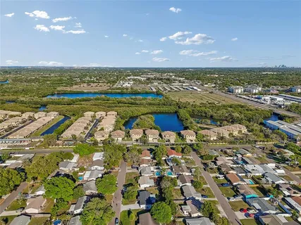 an aerial view of residential houses with outdoor space