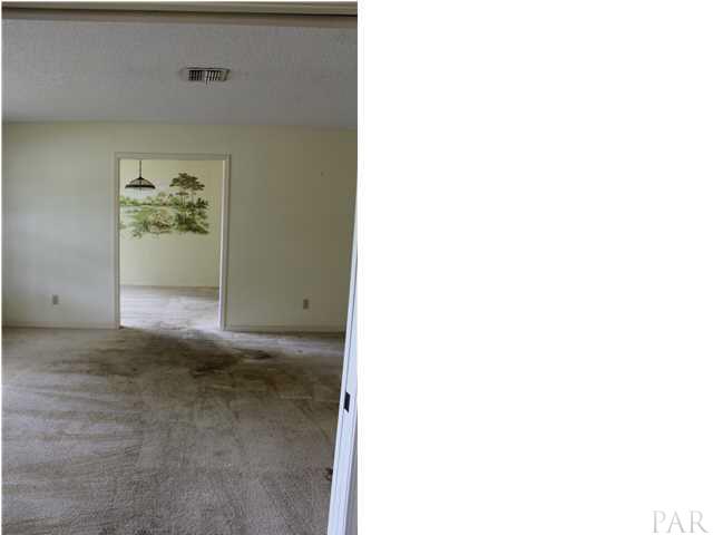 7377 Chesterfield Road Pensacola, FL 32506 - Photo 4 of 25 View from foyer into living room and dining room