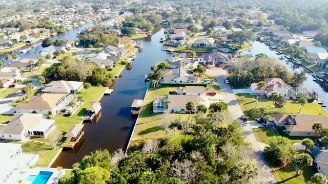 an aerial view of residential houses with outdoor space