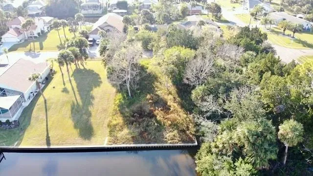 a view of a lake with couches in the patio