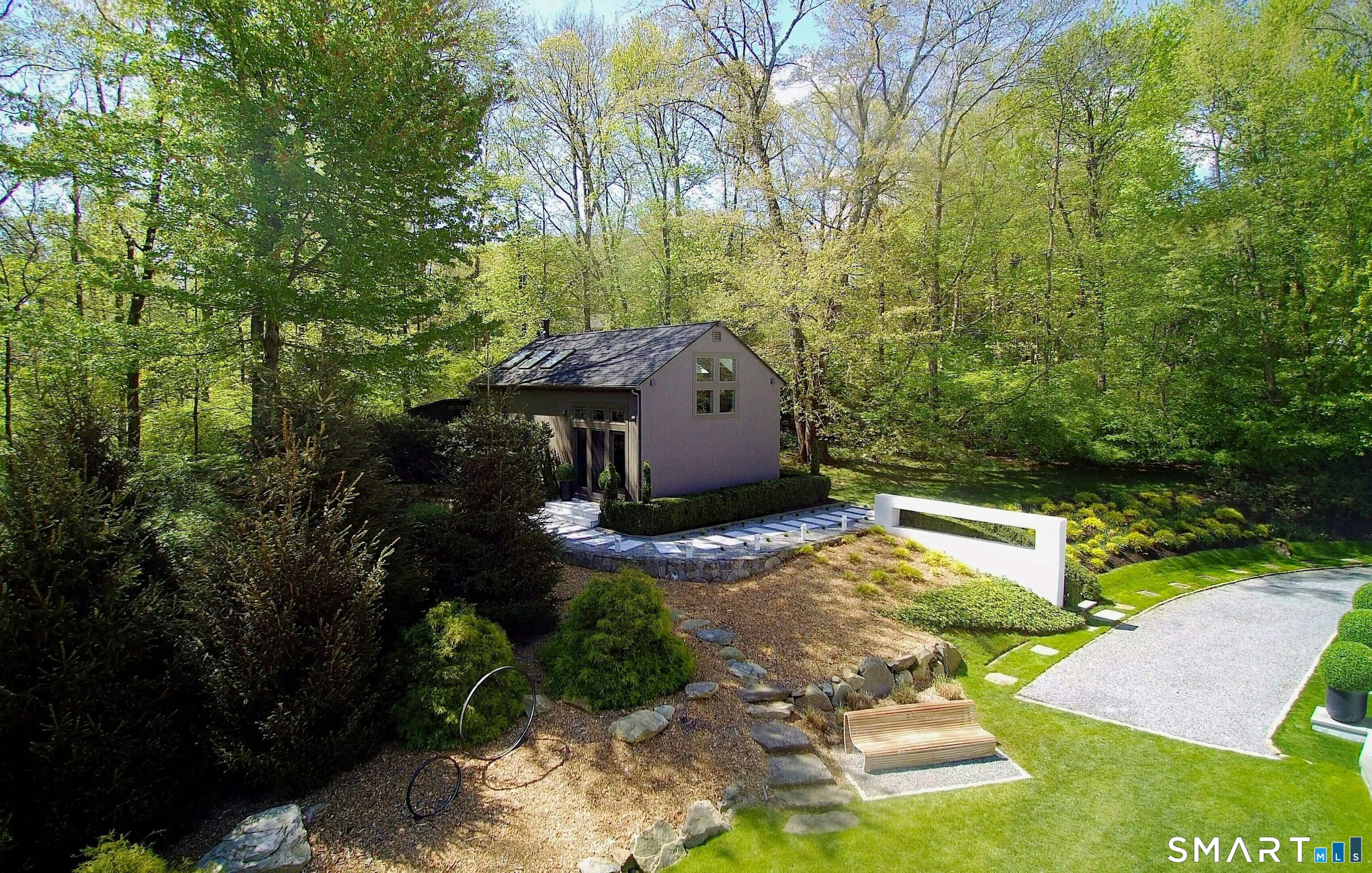 300 Sturges Ridge Road Wilton, CT 06897 - Photo 37 of 40 a view of a house with a yard