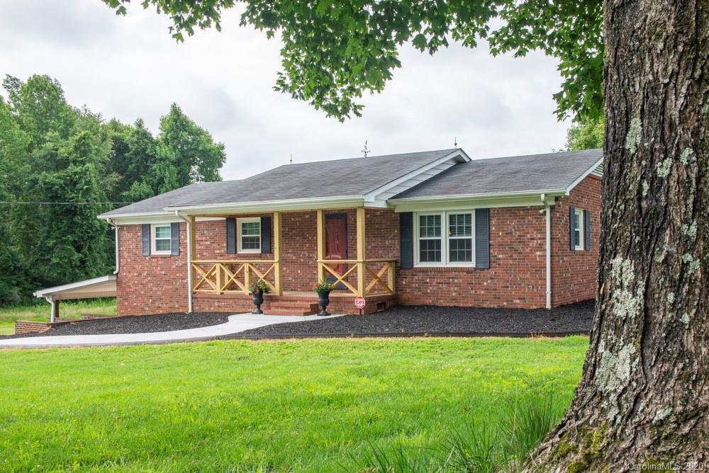 8585 Castor Road Salisbury, NC 28146 - Photo 1 of 39 a front view of house with a garden and patio