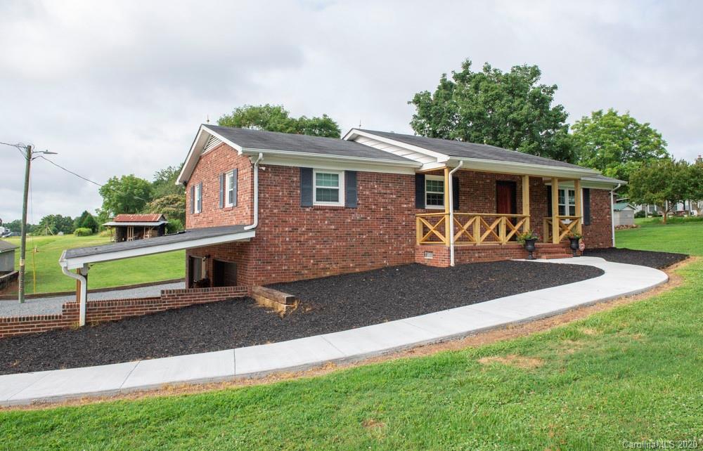 8585 Castor Road Salisbury, NC 28146 - Photo 2 of 39 a front view of a house with a yard