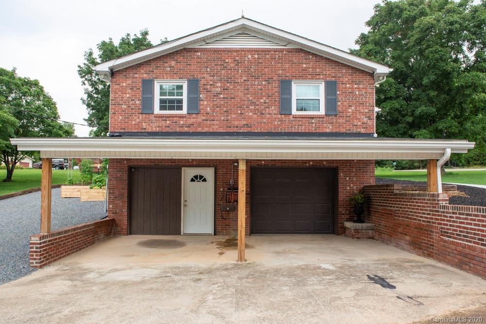 8585 Castor Road Salisbury, NC 28146 - Photo 12 of 39 a front view of a house with a garage