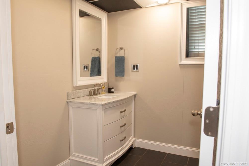8585 Castor Road Salisbury, NC 28146 - Photo 13 of 39 a bathroom with a sink and a mirror