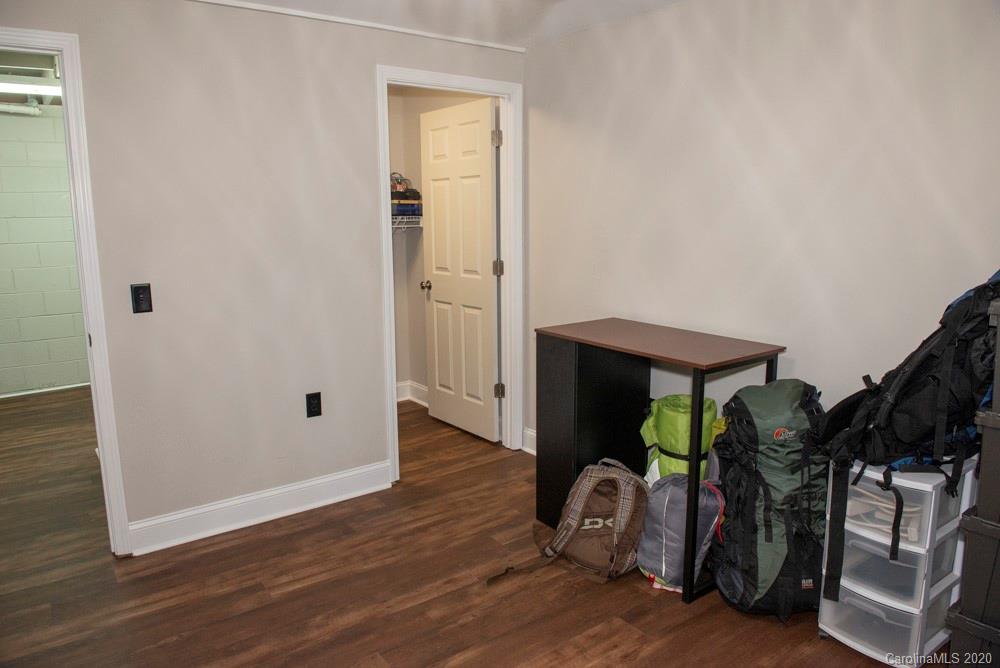8585 Castor Road Salisbury, NC 28146 - Photo 19 of 39 an entryway and a room with wooden floor