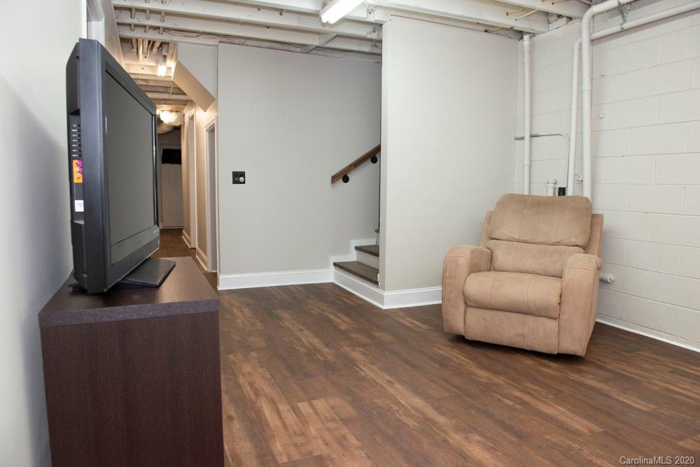8585 Castor Road Salisbury, NC 28146 - Photo 21 of 39 a living room with furniture and a flat screen tv
