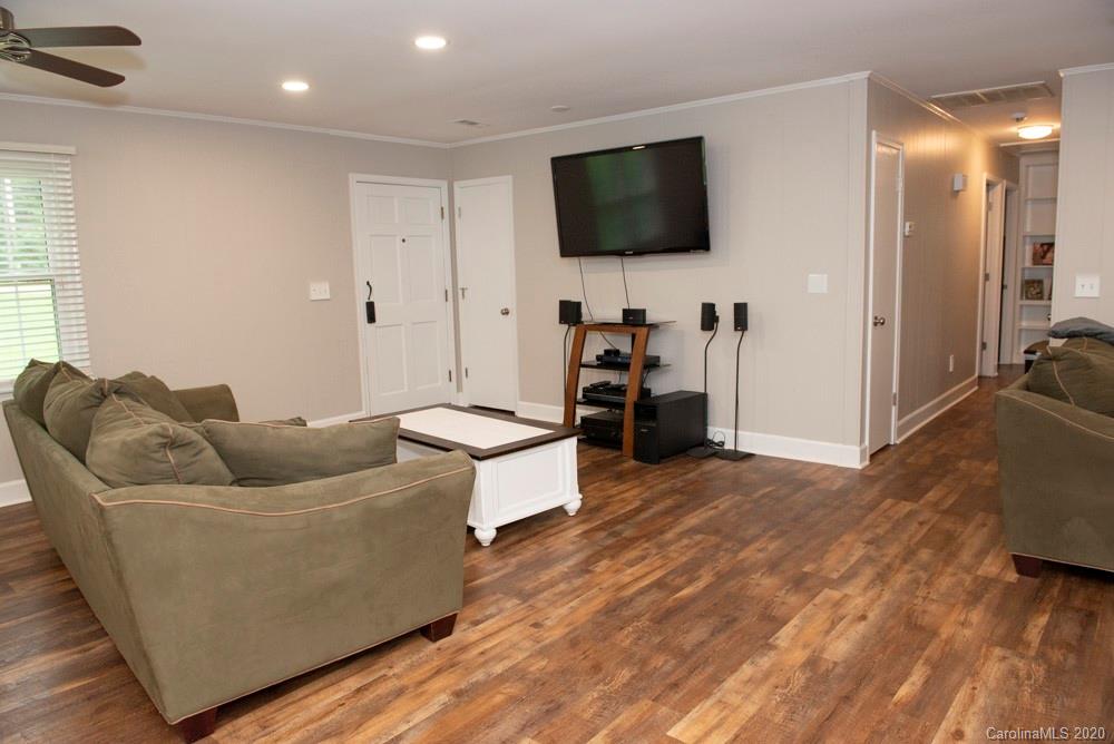 8585 Castor Road Salisbury, NC 28146 - Photo 25 of 39 a living room with furniture and a flat screen tv
