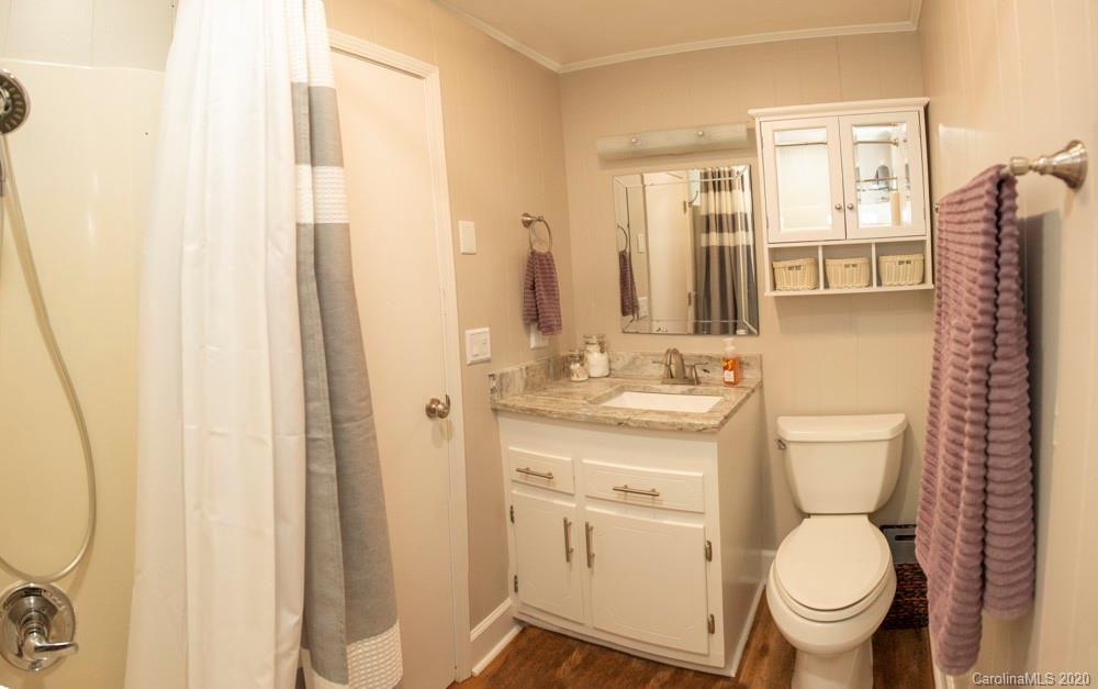 8585 Castor Road Salisbury, NC 28146 - Photo 30 of 39 a bathroom with a toilet sink and a mirror