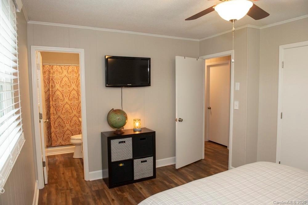 8585 Castor Road Salisbury, NC 28146 - Photo 32 of 39 a living room with furniture and a flat screen tv