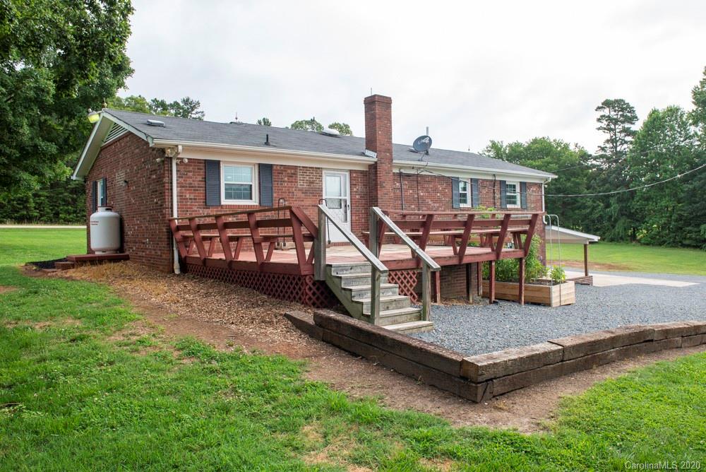 8585 Castor Road Salisbury, NC 28146 - Photo 7 of 39 a front view of a house with garden