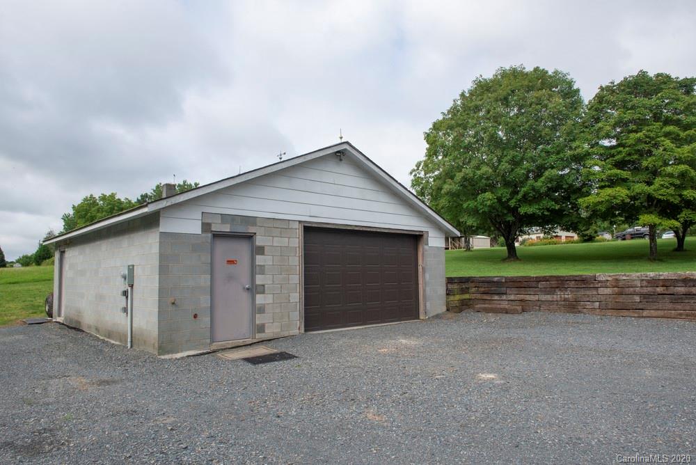8585 Castor Road Salisbury, NC 28146 - Photo 10 of 39 a view of a house with a yard and garage