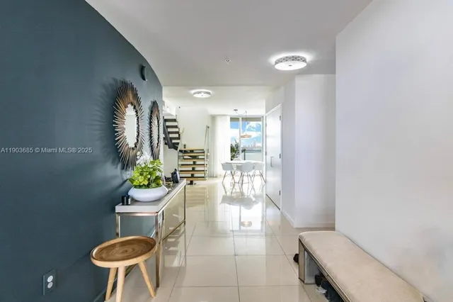 a bathroom with a toilet a sink and a mirror