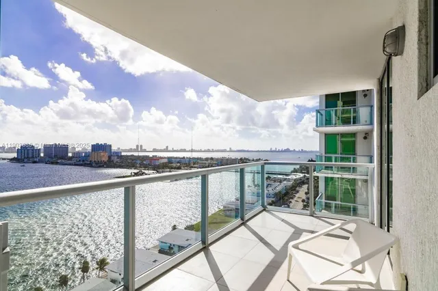 a view of balcony with furniture