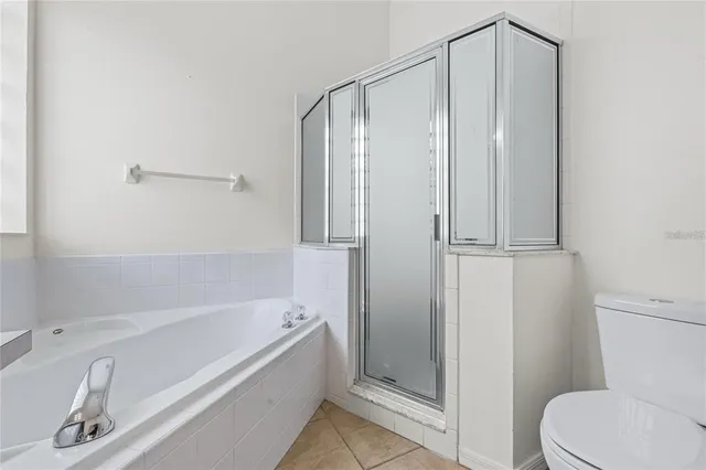 a bathroom with a tub and a shower