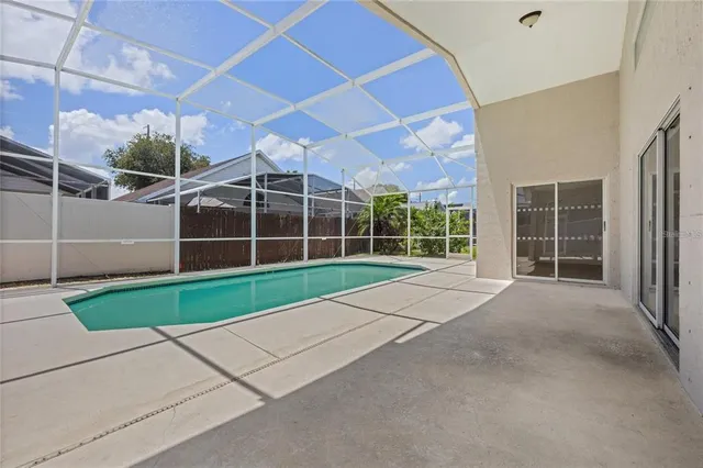 a view of a house with a yard and large window
