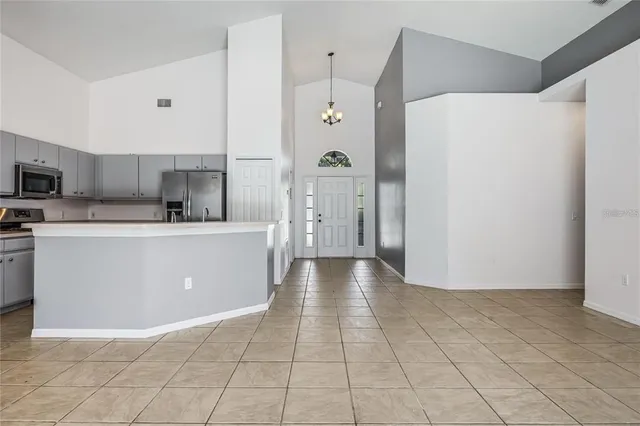 a view of a kitchen with electric appliances