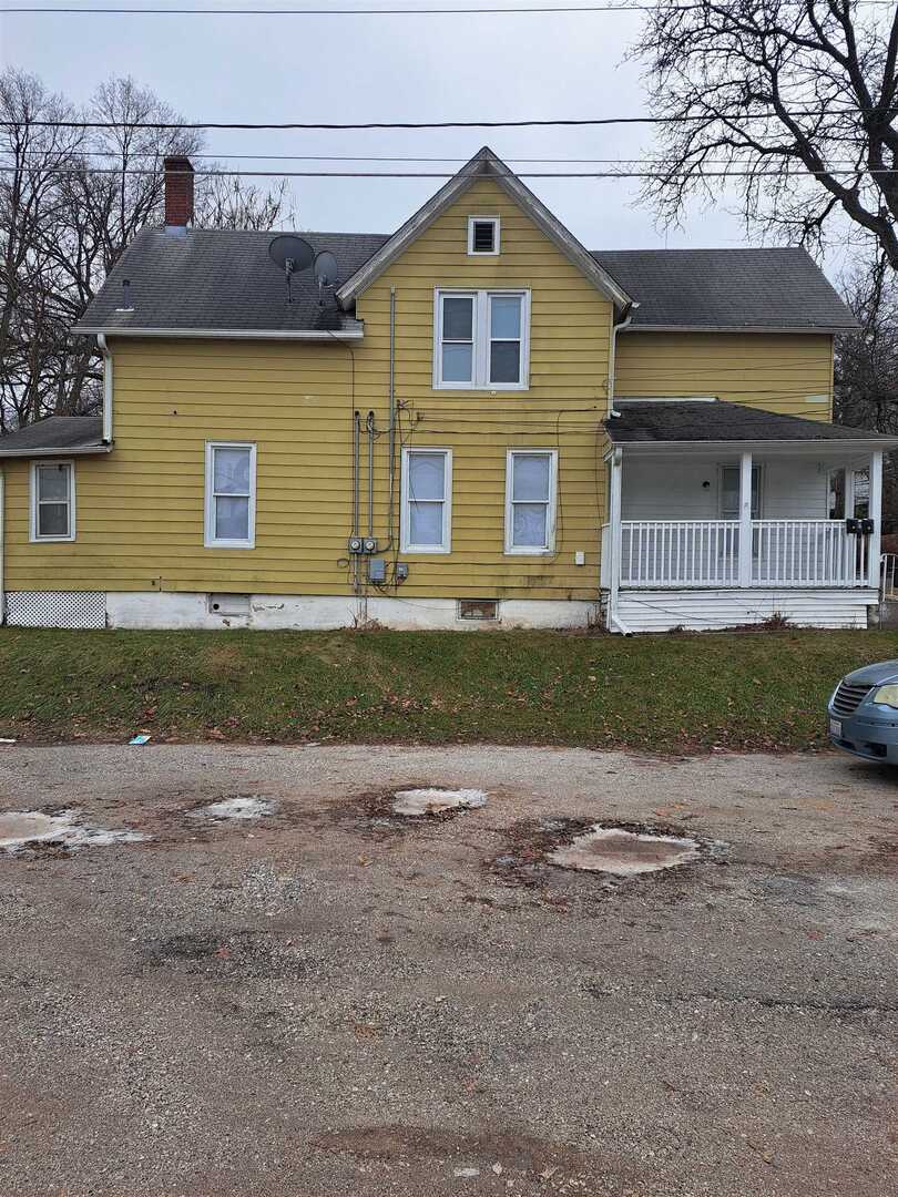 801 41st Street Rock Island, IL 61201 - Photo 2 of 8 a front view of a house with a yard and garage
