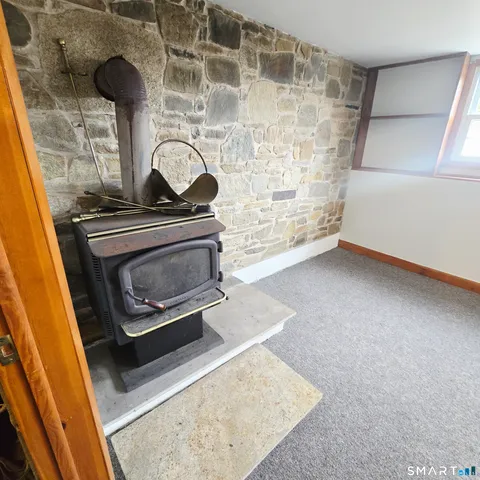 a stove top oven sitting inside of a kitchen
