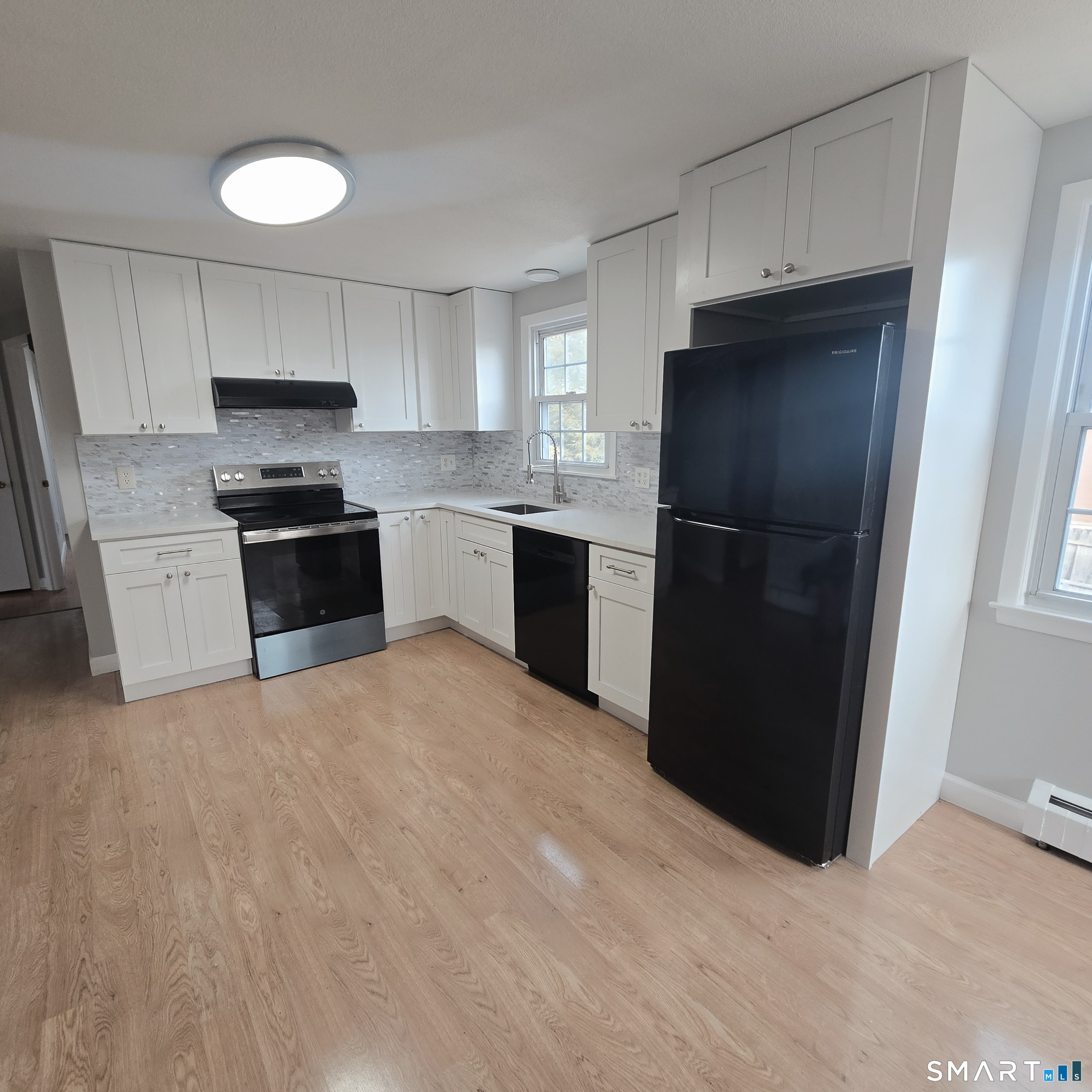 26 Tifton Road Wethersfield, CT 06109 - Photo 5 of 26 a kitchen with a refrigerator and a sink
