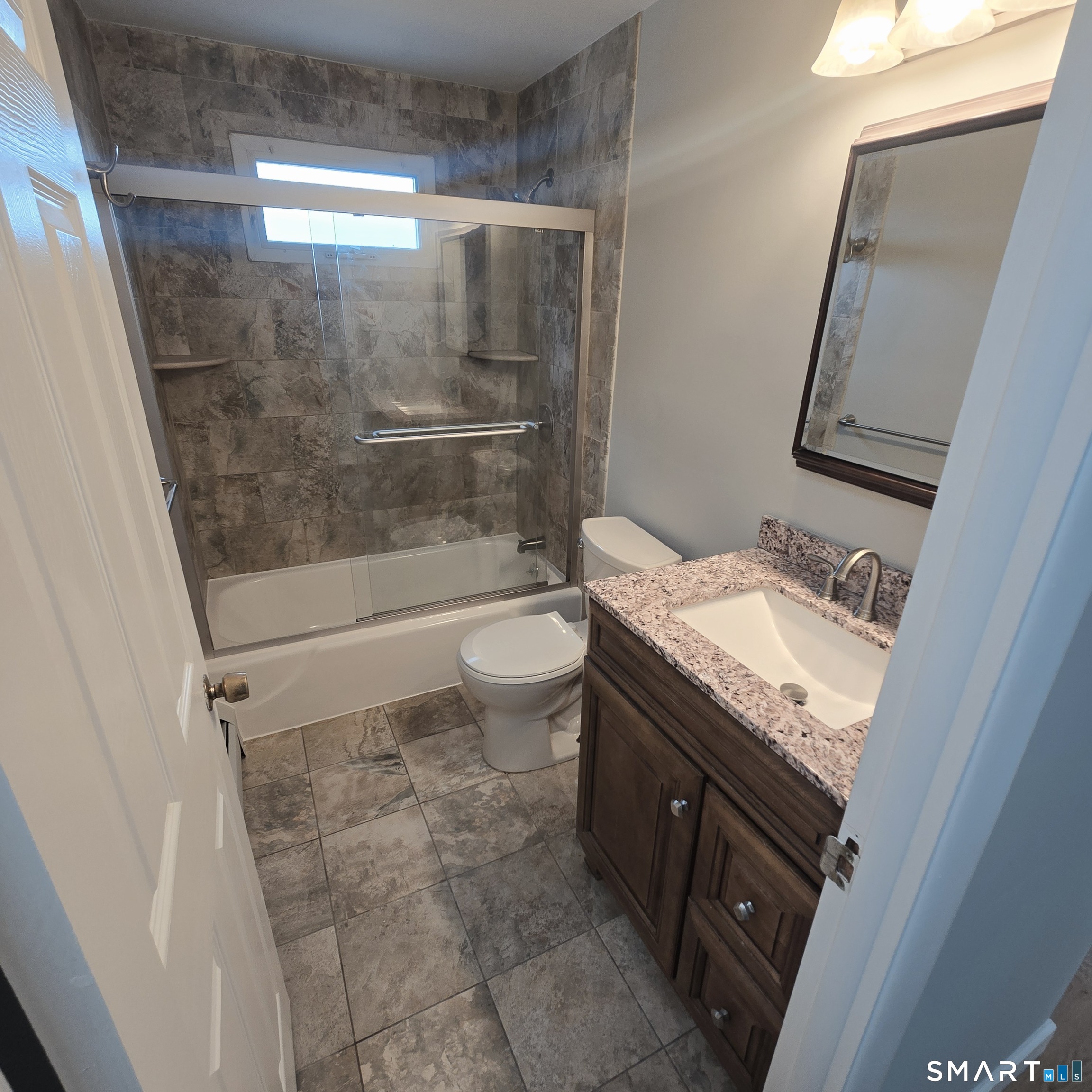 26 Tifton Road Wethersfield, CT 06109 - Photo 6 of 26 a bathroom with a granite countertop sink toilet and shower