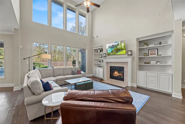 a living room with furniture a window and a fireplace