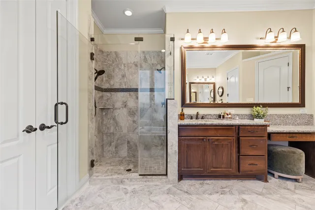 a spacious bathroom with a shower sink and mirror