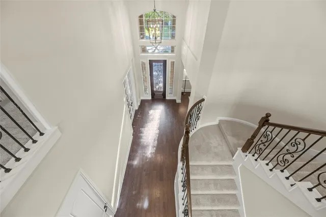 a view of a living room with furniture and entryway