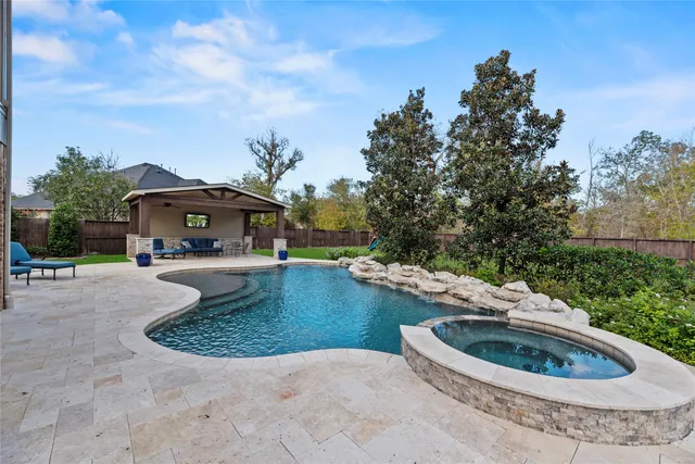 a view of a swimming pool with a patio