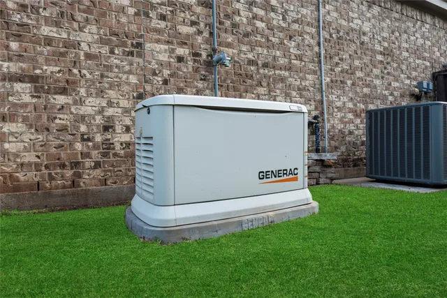 a backyard of a house with wooden fence and a bench