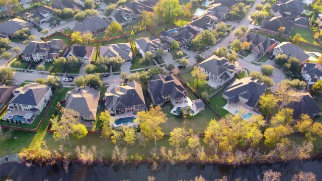 a aerial view of residential houses with outdoor space