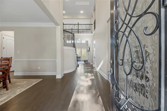 a view of an entryway with wooden floor