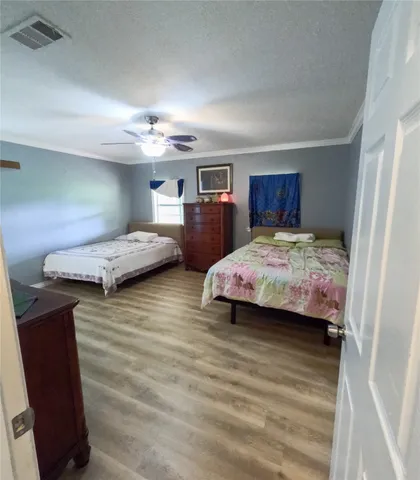 a bedroom with bed and window