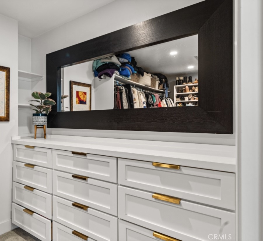 108 Estates Drive Chico, CA 95928 - Photo 20 of 45 a view of a hallway with a large mirror and a dresser