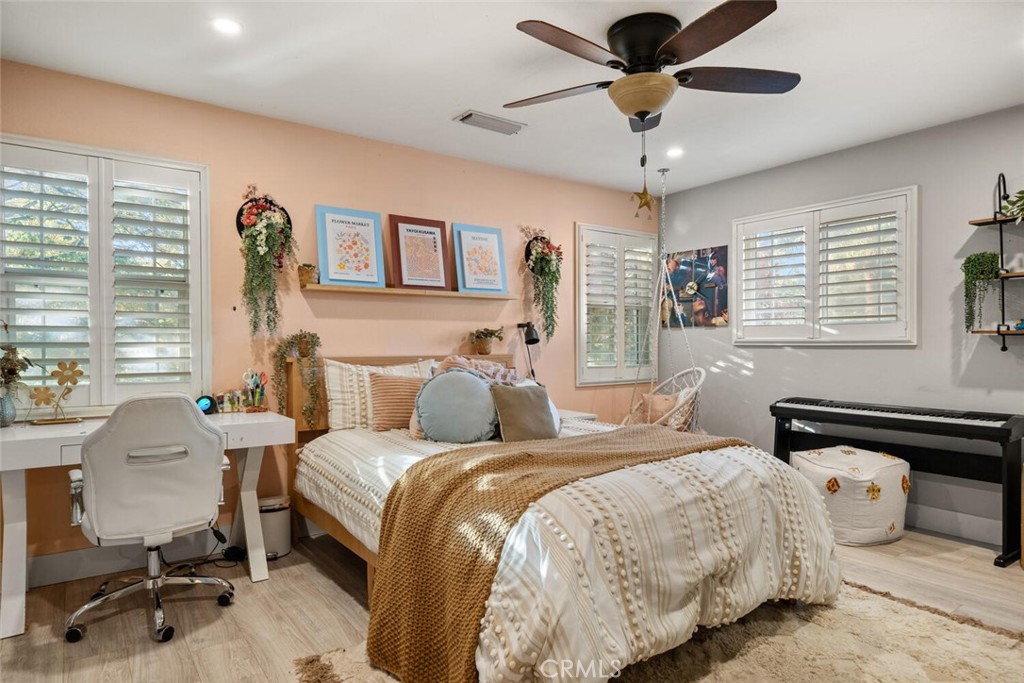 108 Estates Drive Chico, CA 95928 - Photo 23 of 45 a bedroom with a bed and a chandelier