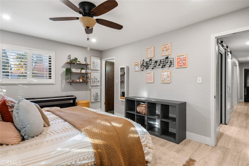 108 Estates Drive Chico, CA 95928 - Photo 24 of 45 a bedroom with a bed and a chandelier